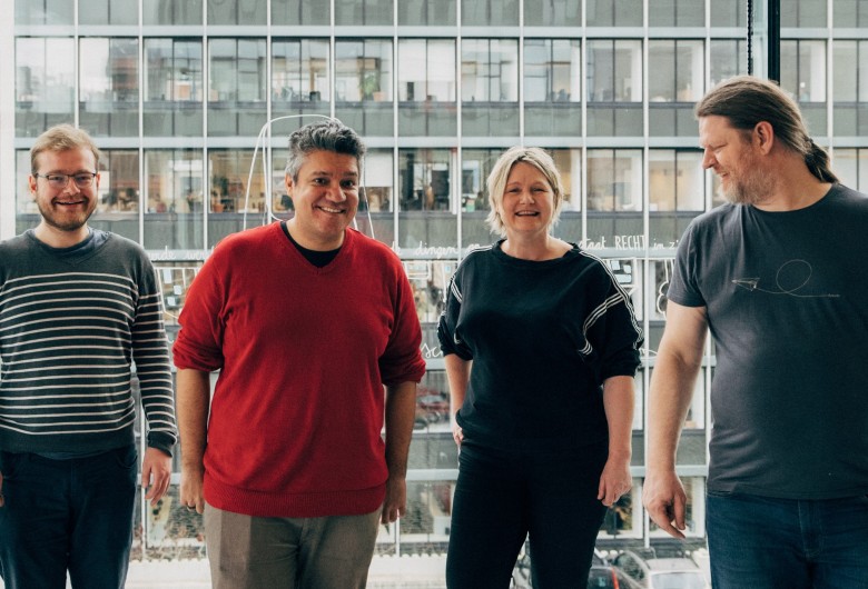 Groepsfoto van de 4 ontwikkelaars van Coach Codi